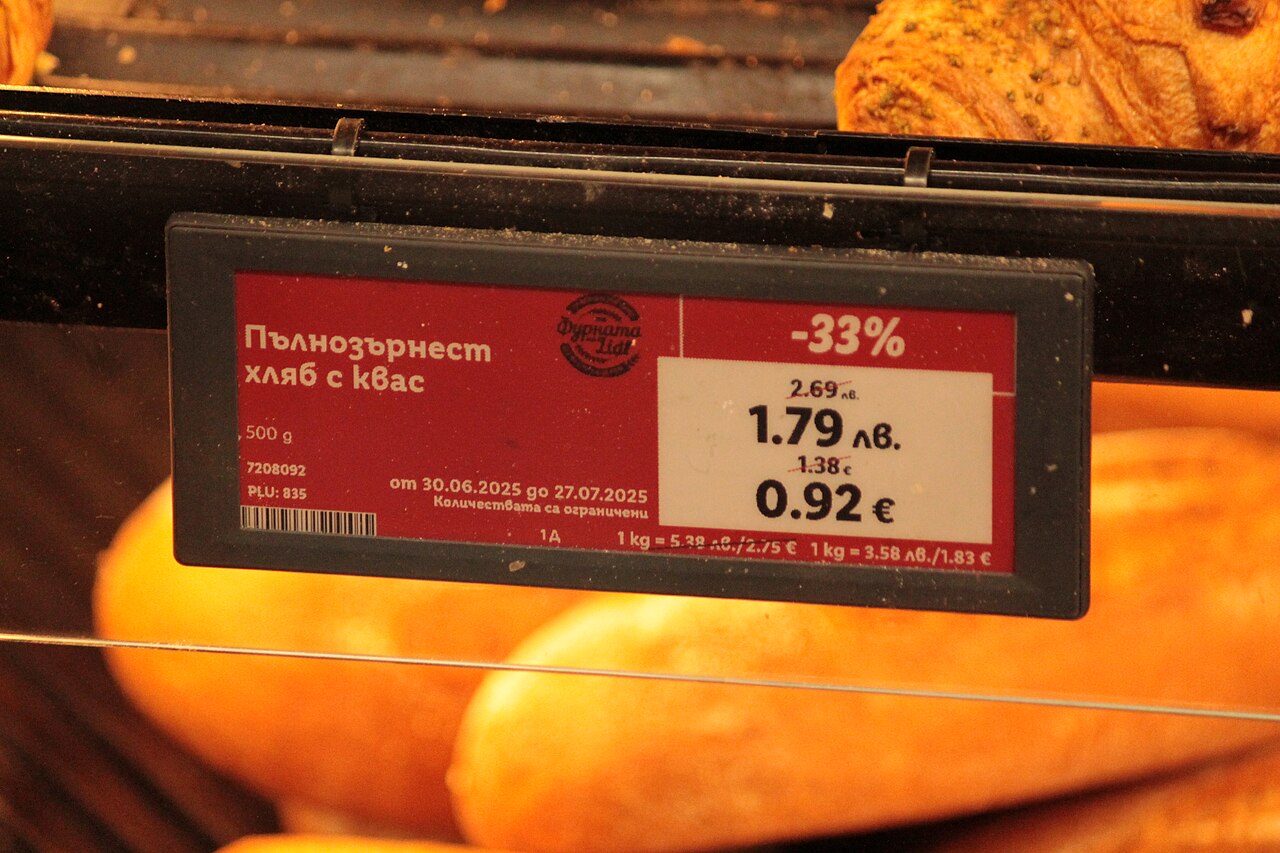 An electronic price tag showing a price in two currencies