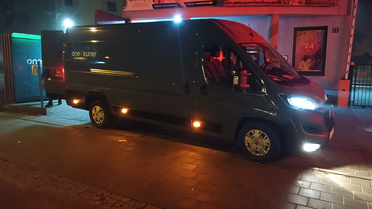 A parcel delivery van stopped at night