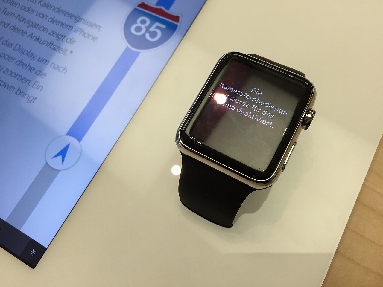 An Apple Watch showing a notification on a demo table