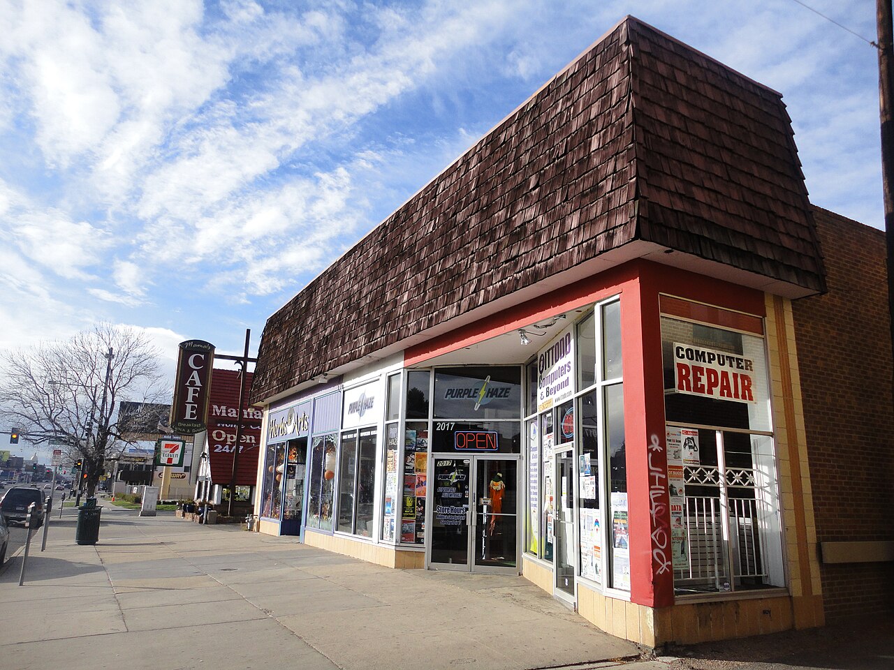 The front of a computer repair shop on a street corner