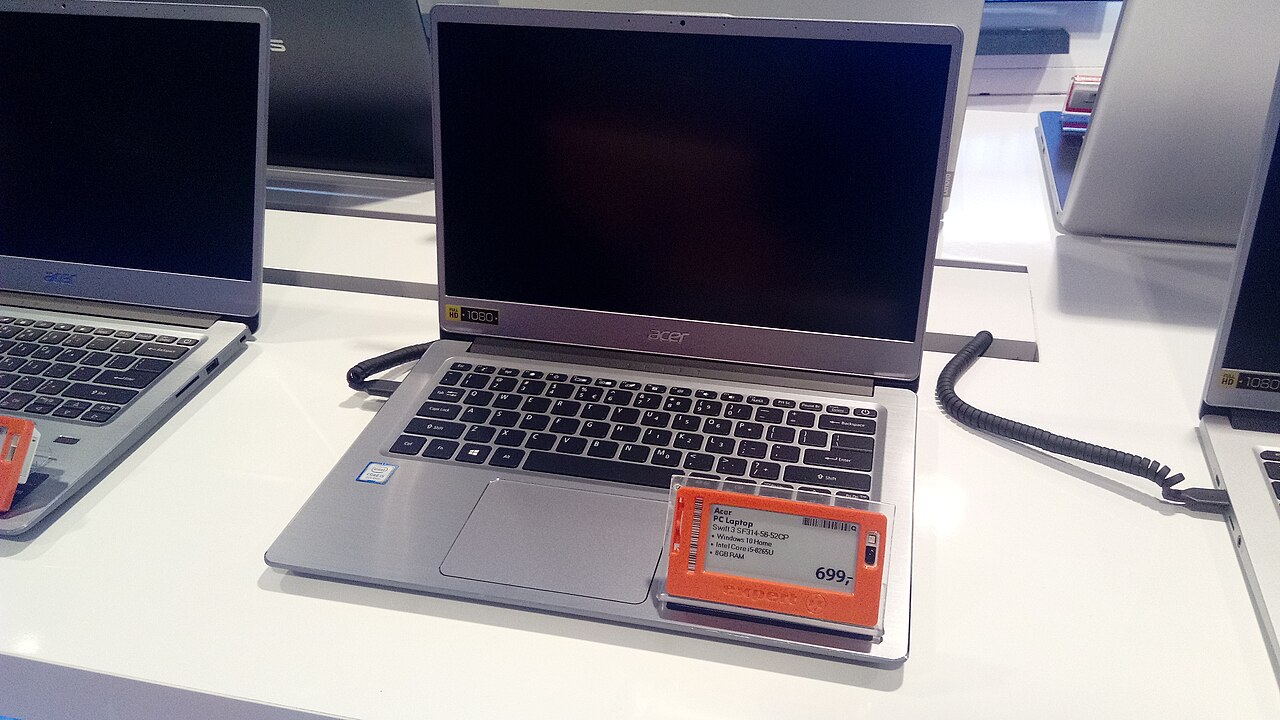 Laptops on a store display with electronic price labels