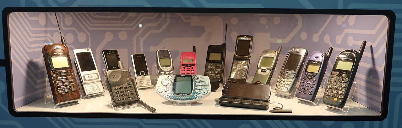 A display case of older mobile phones